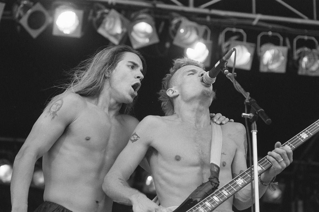 Vocalist Anthony Kiedis and bassist Flea (pictured in August 1989) have remained with the Red Hot Chili Peppers through the band